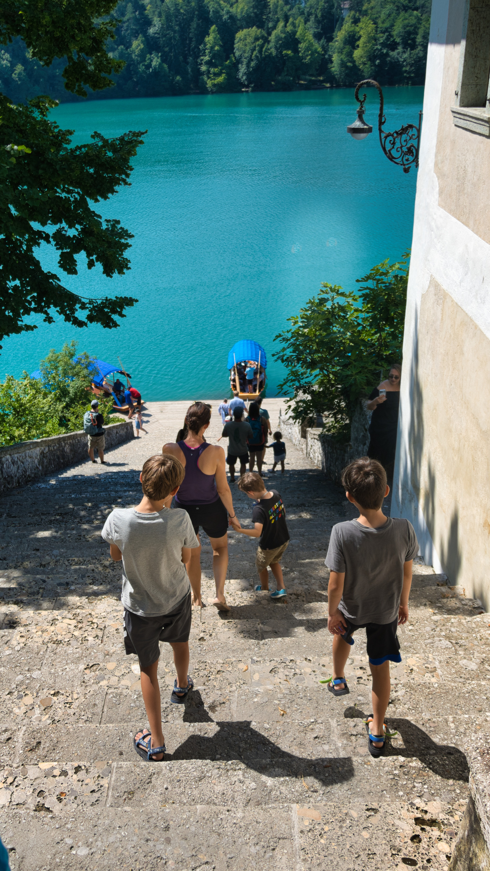 Walking down the church's 99 steps, Pletna boats in the background