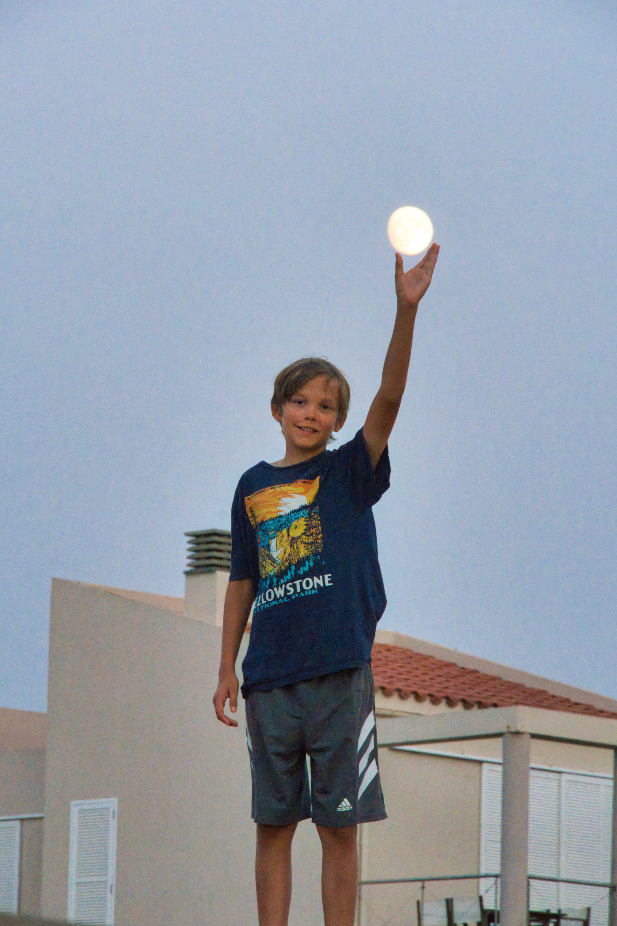Luke holding an almost full moon